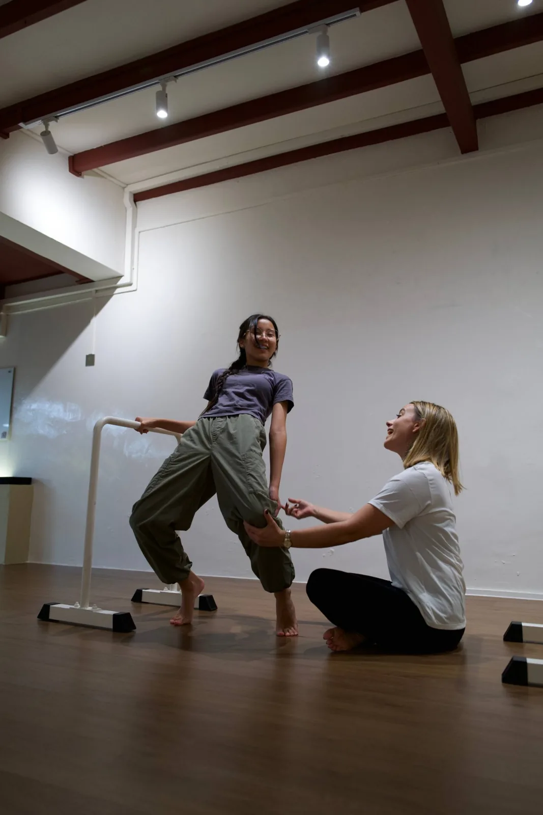 Bronwen coaching a young person during a balance challenge